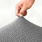 pilkos-spalvos-fotelio-uzvalkalas-su-zakardo-tipo-rastu